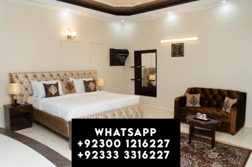 a bedroom with a bed and a couch in a room at Diamond Lodge in Karachi