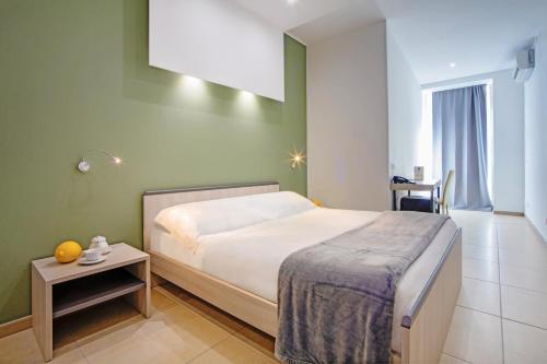 Ένα ή περισσότερα κρεβάτια σε δωμάτιο στο San Giorgio Palace Hotel Ragusa Ibla