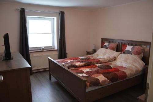 Säng eller sängar i ett rum på Ferienhaus sonniges Altenau Harz