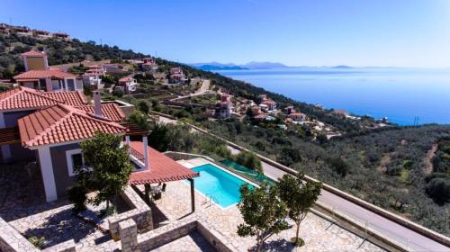 arial view of a villa with a view of the water at Apollo Romantic Sea View Villa in Kiveri