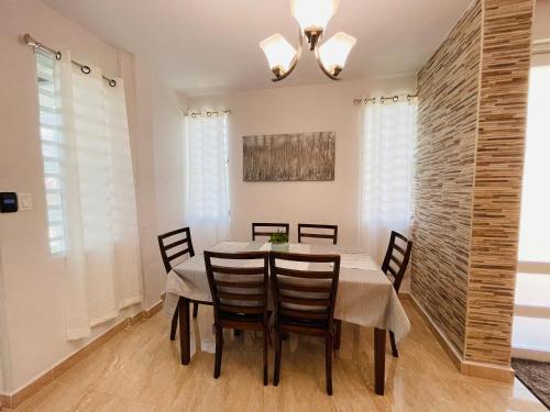 a dining room with a table and chairs at Private Oasis with Jacuzzi and Cabana Pet Friendly in San Juan