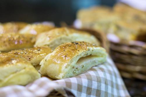 a bunch of pastries in a basket at Hotel Golden Park Sorocaba & Convenções by Nacional Inn in Sorocaba