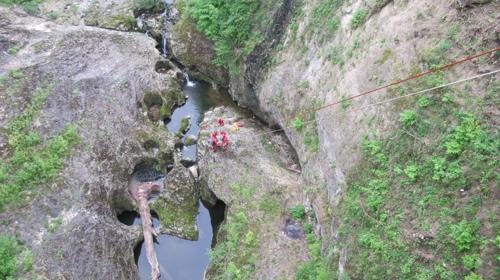 an aerial view of a river between two rocks at Apartmani Lovro in Ogulin