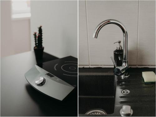 a kitchen counter with a sink and a faucet at Apartamenty „Nad Popradem” in Rytro