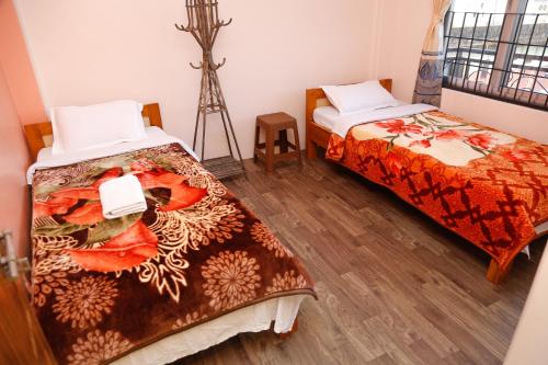 Ένα ή περισσότερα κρεβάτια σε δωμάτιο στο Buddhi Boutique