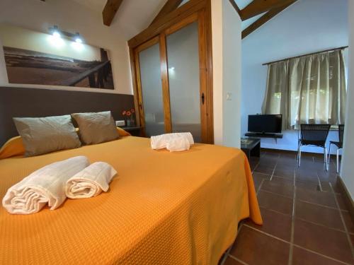 Postel nebo postele na pokoji v ubytování Casita con jardín privado y piscina compartida