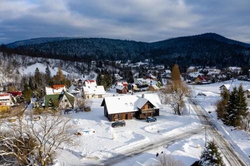 an aerial view of a town in the snow at Cisna Chata - Bieszczady in Cisna