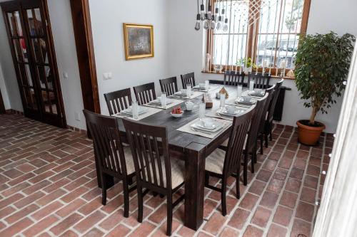 a dining room with a wooden table and chairs at Cisna Chata - Bieszczady in Cisna