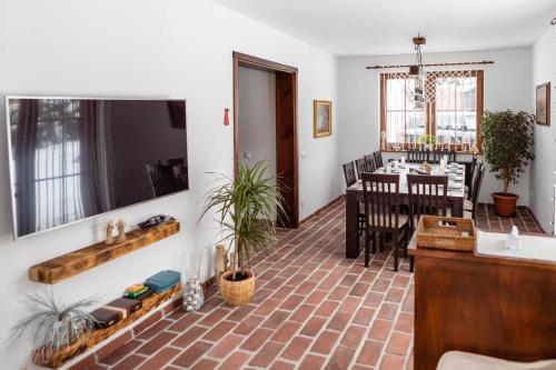 a living room with a table and a dining room at Cisna Chata - Bieszczady in Cisna
