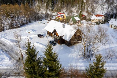 an aerial view of a house covered in snow at Cisna Chata - Bieszczady in Cisna