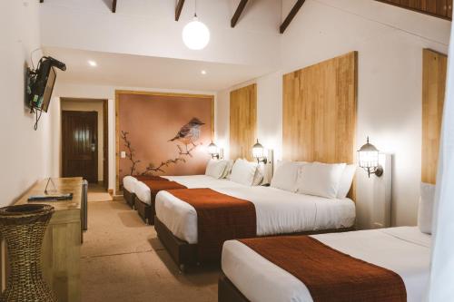En eller flere senge i et værelse på Termales Santa Rosa De Cabal