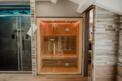 a bathroom with a shower with a glass door at Miryam House Affittacamere Suite e Relax in San Severo