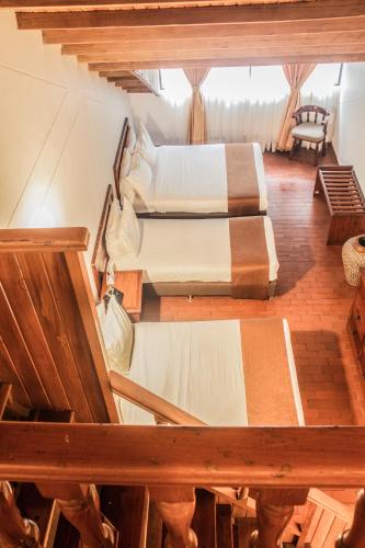 a view of two beds in a room at Termales Santa Rosa De Cabal in Santa Rosa de Cabal