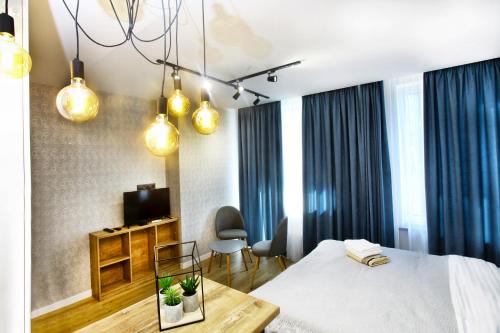 Кровать или кровати в номере Allurapart Inn MVZ, Левобережная МВЦ