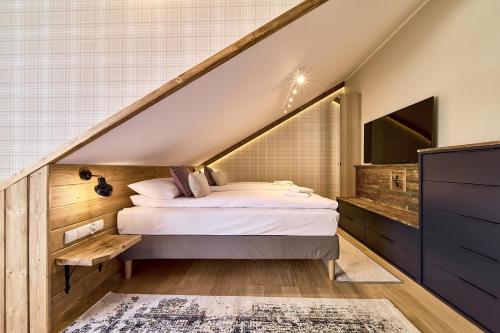 Aparthotel Giewontにあるベッド