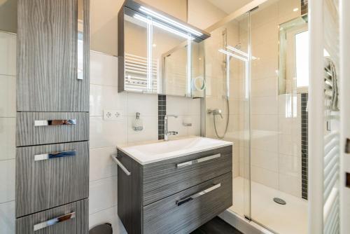 a bathroom with a sink and a shower at Villa P18 in Bad Liebenstein