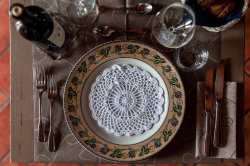 a plate with a pattern on it sitting on a table at Agriturismo Parco Fiorito in Cortona