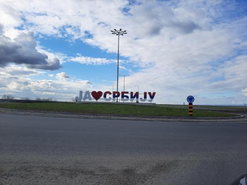 a sign with a heart on the side of a road at Vila Sava in Jarak