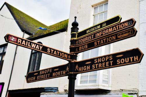 a street sign with many signs on a pole at Black Bull Godmanchester in Huntingdon