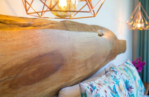 a wooden table sitting on top of a couch at Fortuna in Los Caños de Meca
