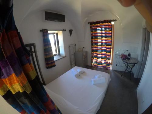 a room with a white tub in a room with a window at Horizon Pantelleria in Pantelleria