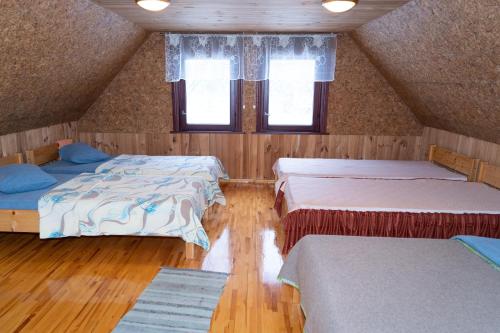 En eller flere senge i et værelse på "Čiekuri"