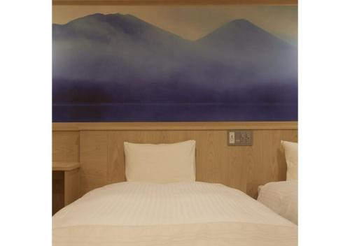 Lova arba lovos apgyvendinimo įstaigoje Sakura Sky Hotel - Vacation STAY 18449v