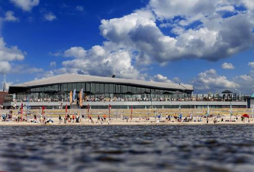 a crowd of people on the beach in front of a stadium at Nieuwe Beachbungalow aan IJsselmeer 39 24 four seasons in Lemmer