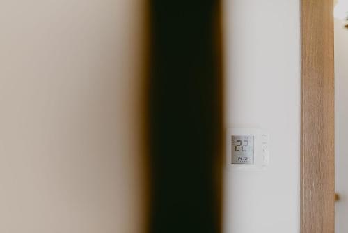 a close up of a light switch on a wall at Rai pe Vale Boutique & Spa in Leordina