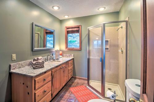 a bathroom with a shower and a sink at Home with Spacious Deck, BBQ, Game Room and Lake Views in Hiawassee