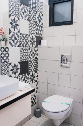 Un baño de Puzzle Apartaments&Studios