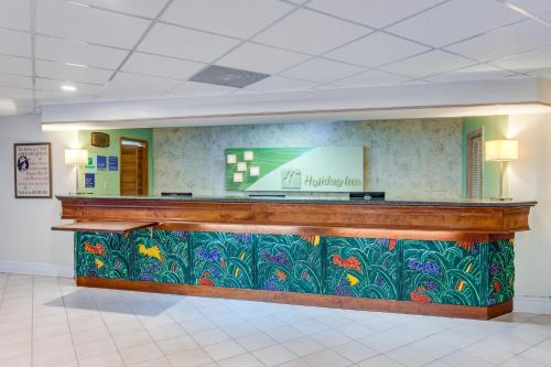 a lobby of a hospital with a reception counter at Holiday Inn Key Largo by IHG in Key Largo