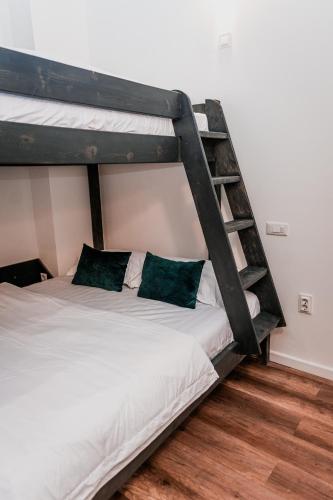 Cama o camas de una habitación en Puzzle Apartaments&Studios