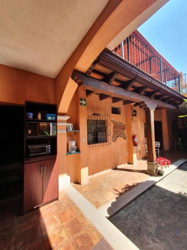 an outdoor kitchen with a staircase on the side of a house at Un Hotel en la Antigua in Antigua Guatemala