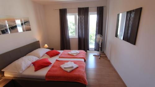 Postel nebo postele na pokoji v ubytování Apartments Stijak-Sorum