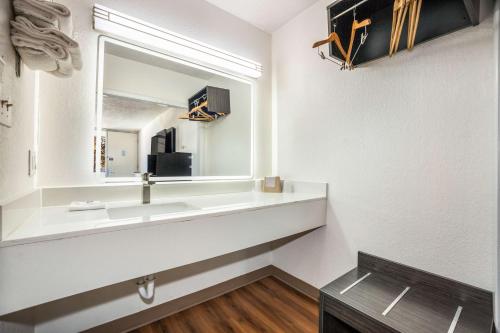 a bathroom with a sink and a mirror at Motel 6-Florence, SC in Florence