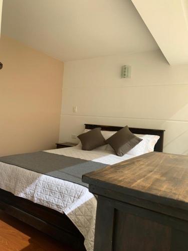 a bedroom with two beds in a room at Hotel Santa Elena Norte in Tunja
