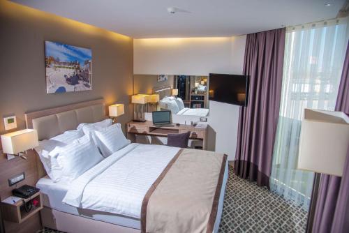Säng eller sängar i ett rum på Best Western Premier Plovdiv Hills