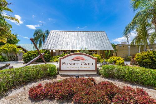 a sign for the sunset grill at the resort at The Blue Lagoon in Ruskin