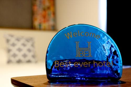 a blue trophy sitting on top of a table at Best ever hotel -SEVEN Hotels and Resorts- in Naha