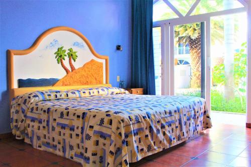 Ένα ή περισσότερα κρεβάτια σε δωμάτιο στο Hotel Mexico Lindo