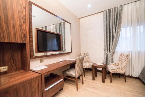 TV o dispositivi per l'intrattenimento presso MidMar Deluxe Hotel