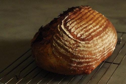 a loaf of bread sitting on a cooling rack at Auberge Hidanomori in Takayama