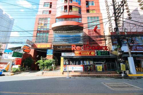 a building with a book store on a city street at RedDoorz at The Providence Tower in Manila