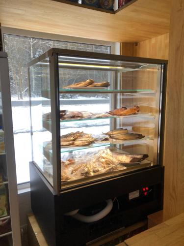 a display case with many different types of food at Complex Uspenka in Odintsovo