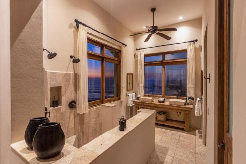 a large bathroom with a shower and a sink at 1037 - Villa Escondida in Santa Cruz Huatulco