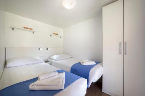 Кровать или кровати в номере Maistra Camping Polari Mobile homes