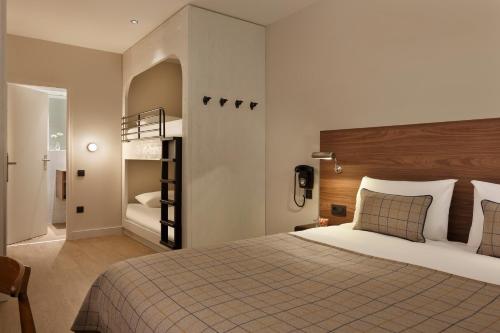 Ένα ή περισσότερα κρεβάτια σε δωμάτιο στο Maison Barbillon Grenoble