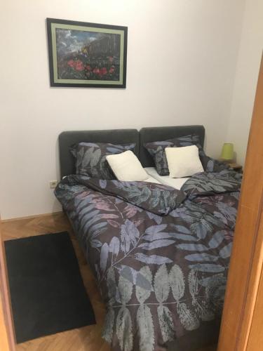 Ένα ή περισσότερα κρεβάτια σε δωμάτιο στο Apartman SLAVONIA 3