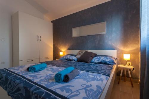 Postel nebo postele na pokoji v ubytování Apartments Didi